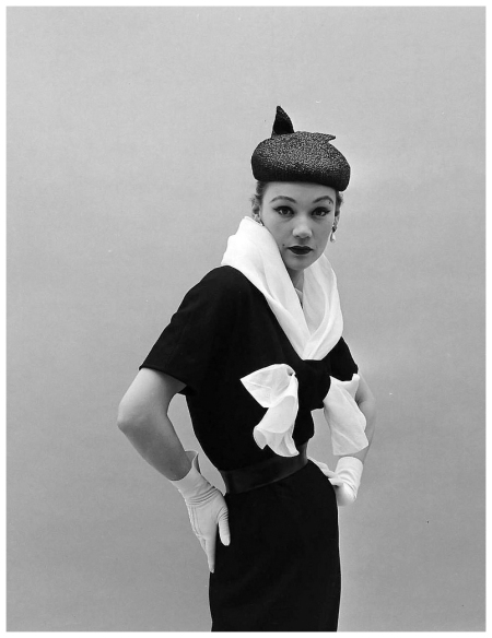 Sophie in Givenchy's slim dress with white organdy fichu, photo by Nat Farbman, Feb. 1952
