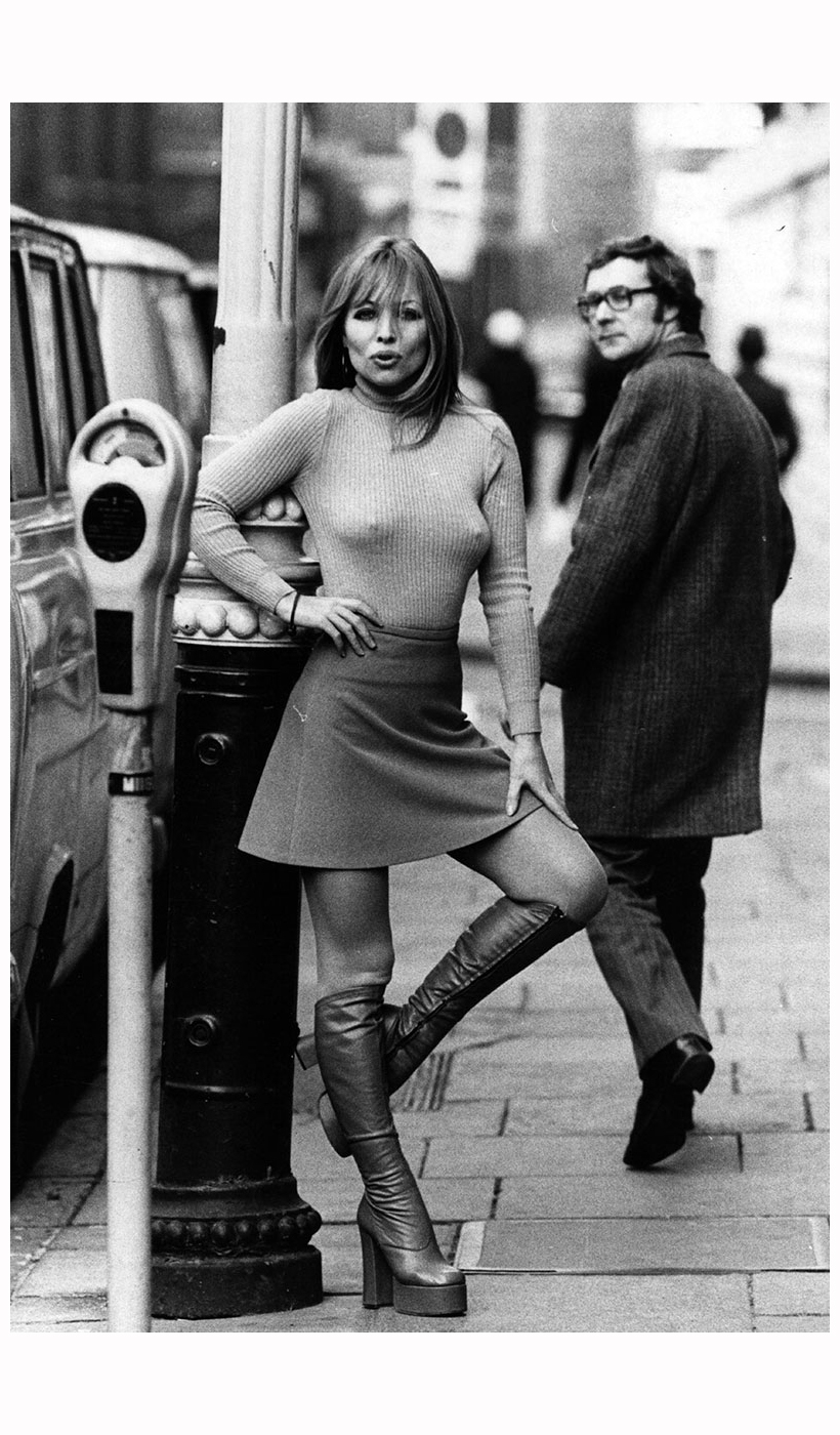 Springwear, circa 1970’s. models a mini skirt and platform boots. 